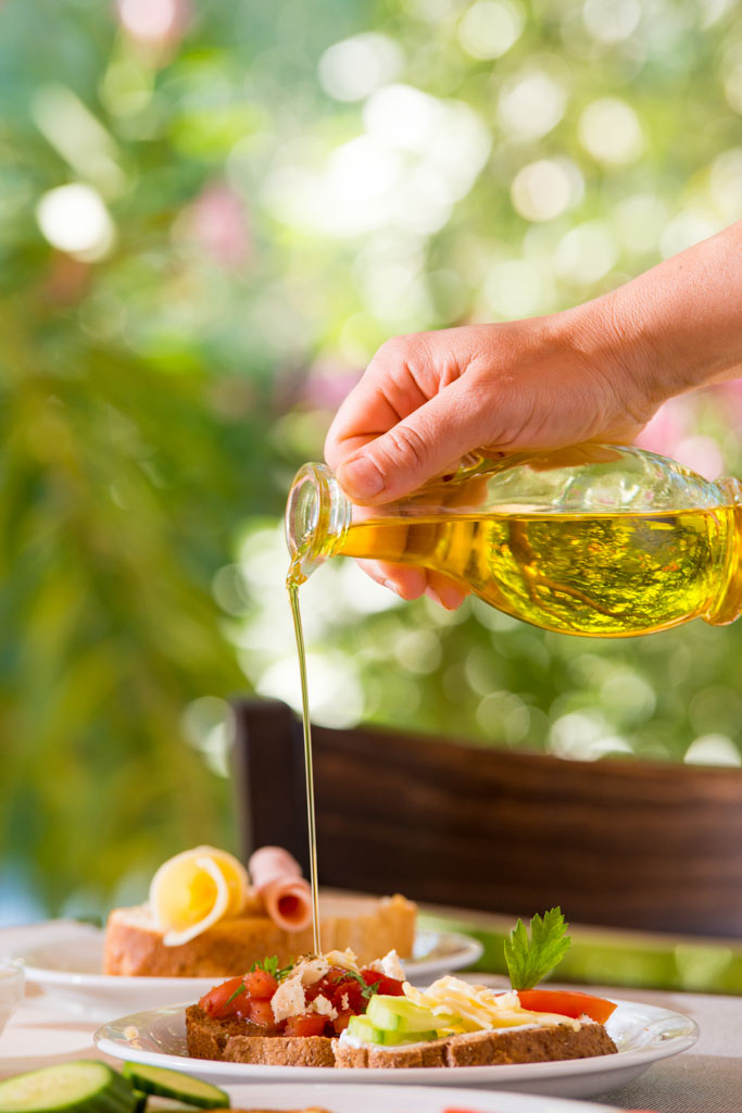 Olive oil over Mediterranean dishes